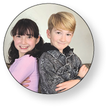 A young boy and girl pose together for a picture. AI generated content